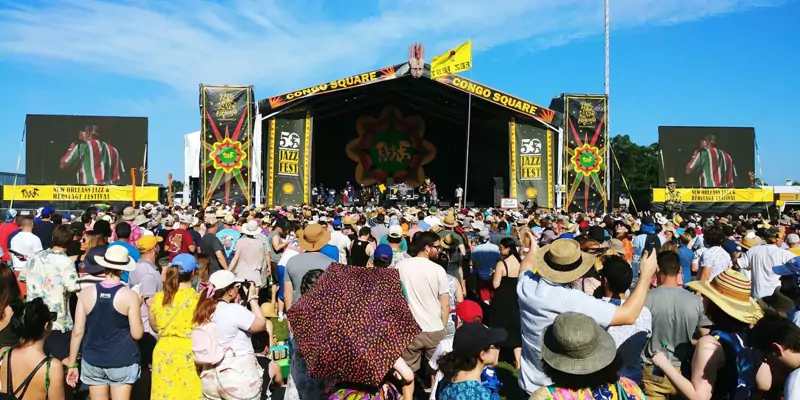 Outdoor festival stage with a large crowd
